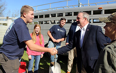 JC Chandler, one of our students, greets Congressman Duncan as he visits the school's show cow barn.
