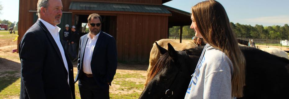 U.S. Rep. Jeff Duncan (left) talks with Caitlyn Krout at the new equine center.