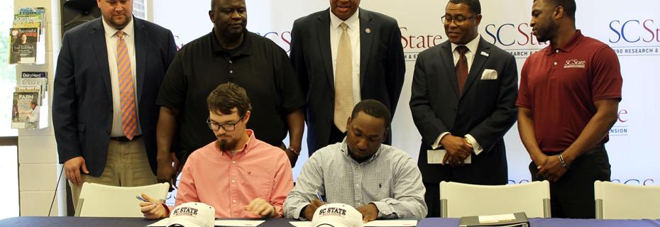 Jake Simpson and Jaquez Perry sign full SC State scholarships.